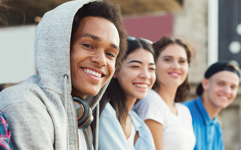The effects of marijuana on teenage brains. Teens smiling.